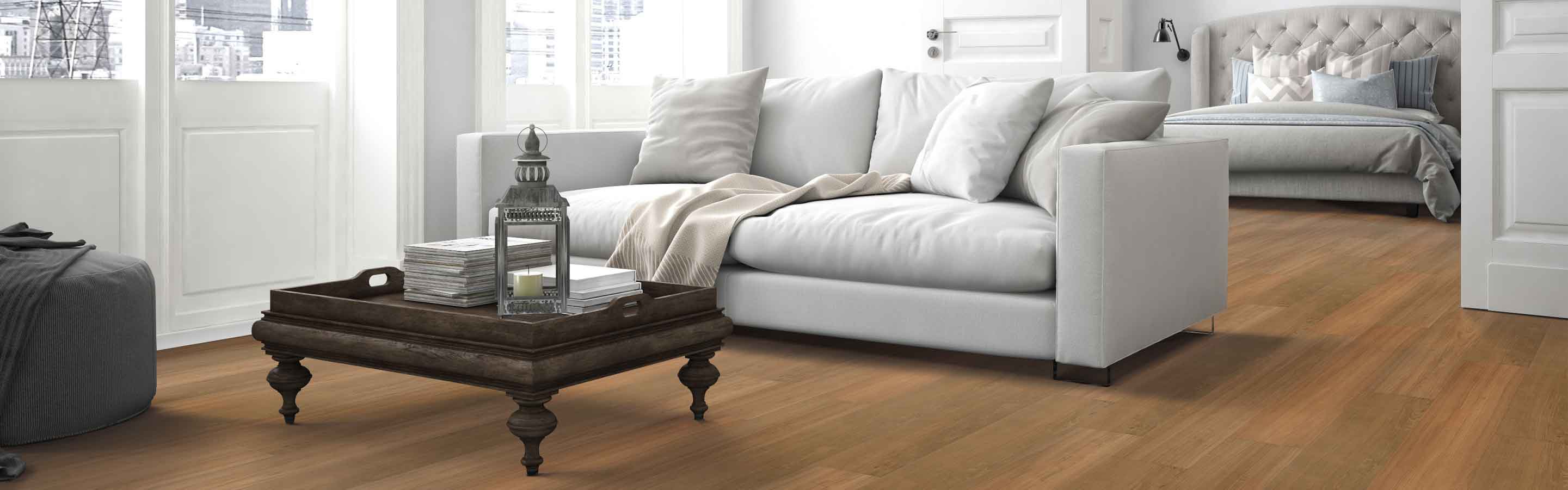 traditional living room with pocket doors to bedroom, honey-hued wood vinyl underfoot